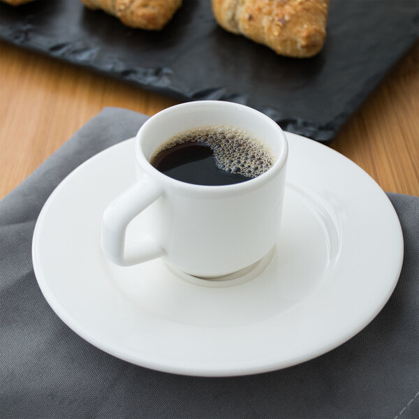 A Villeroy & Boch white porcelain cup of coffee on a saucer.