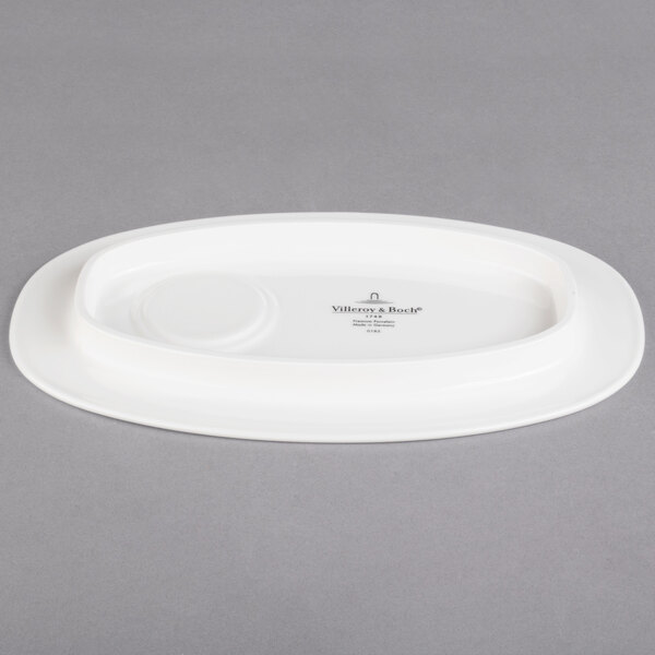 A white oval Villeroy & Boch porcelain party plate.