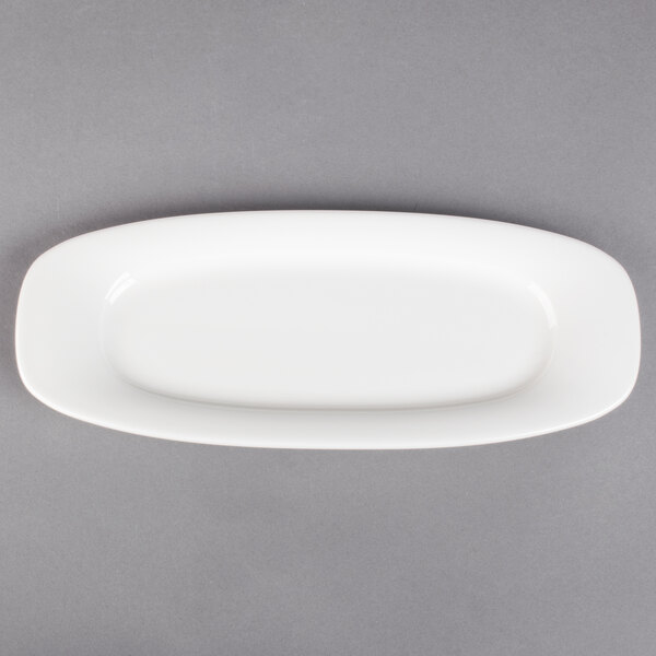 A Villeroy & Boch white porcelain oval platter on a gray surface.