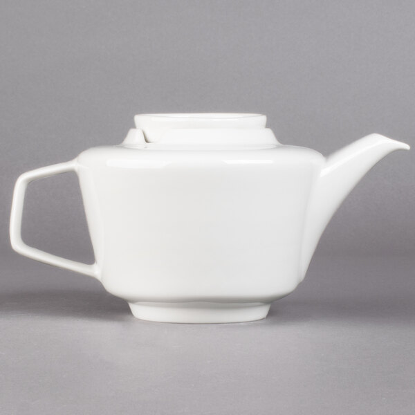 A white Villeroy & Boch teapot with a handle.