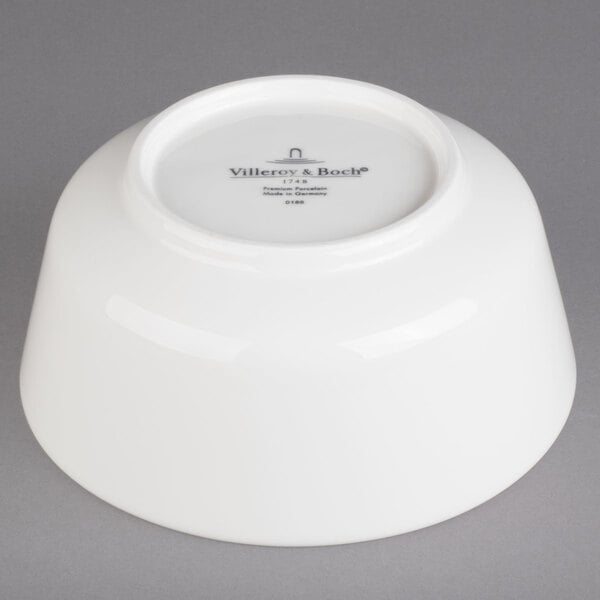 A white Villeroy & Boch porcelain bowl with black text on it.