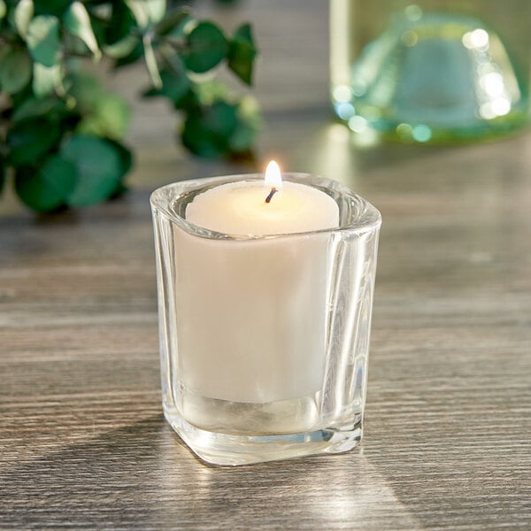 A Sterno 15 Hour Candle in a glass holder.