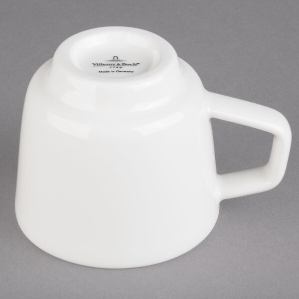 A Villeroy & Boch white porcelain coffee cup with a handle.