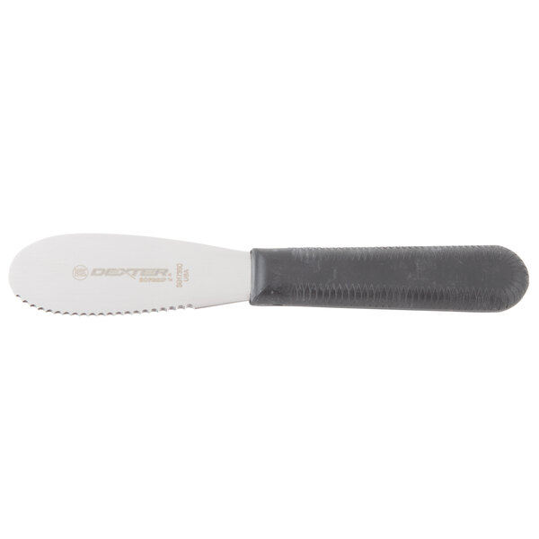 A Dexter-Russell knife with a black handle and a silver blade in a white knife block.
