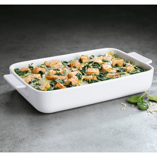 A white rectangular Villeroy & Boch baking dish with food in it.