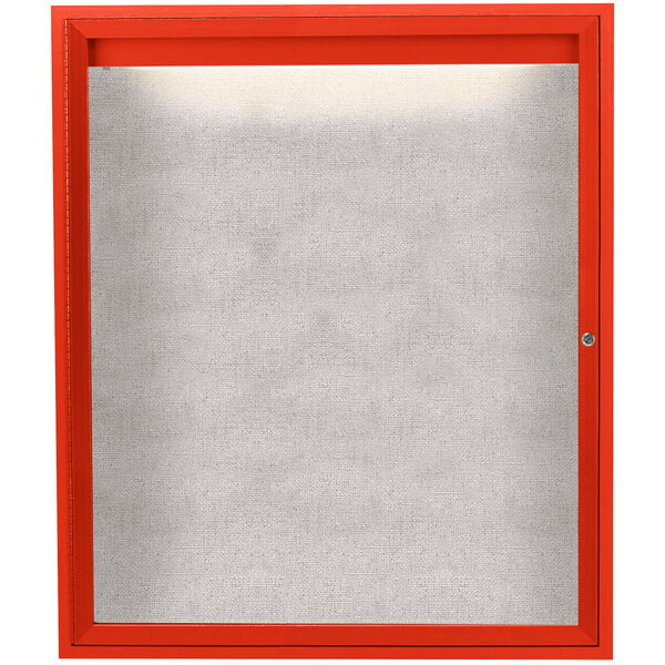 A white board with a red frame inside a red Aarco bulletin board cabinet.