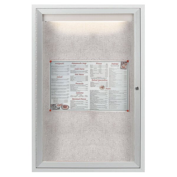 An Aarco outdoor lighted bulletin board cabinet with a menu in a glass case.