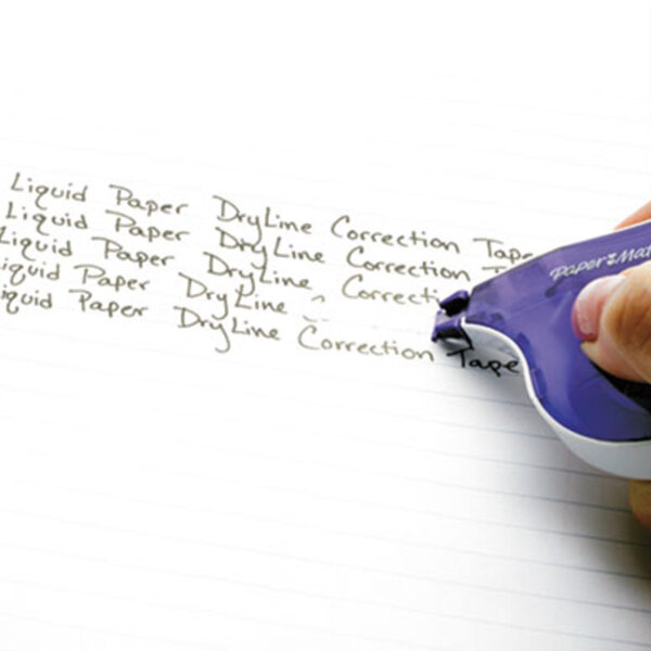 A hand using a Paper Mate Liquid Paper DryLine tape dispenser to correct a list of writing.