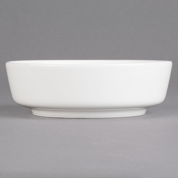 A Villeroy & Boch white porcelain bowl on a gray background.
