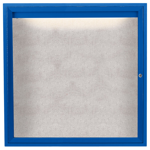 A blue framed enclosed glass bulletin board with a white background.