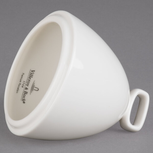 A white porcelain bell cover with a handle.