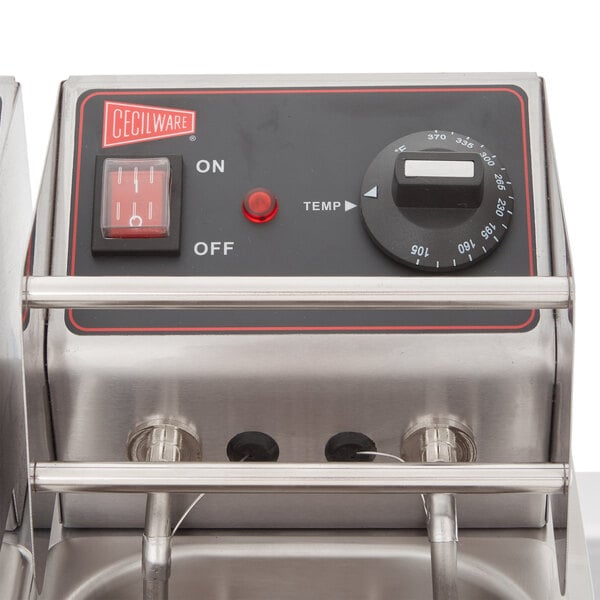 A Cecilware stainless steel electric countertop deep fryer on a grey surface.
