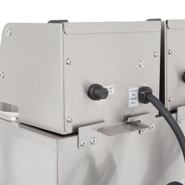 A Cecilware stainless steel electric countertop deep fryer with two metal fry tanks and a metal door.