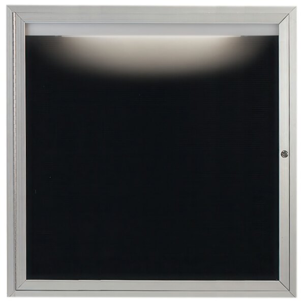 A white square frame with a black screen inside.