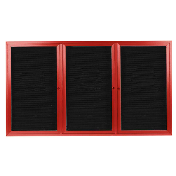 A red rectangular cabinet with three black letter boards inside.