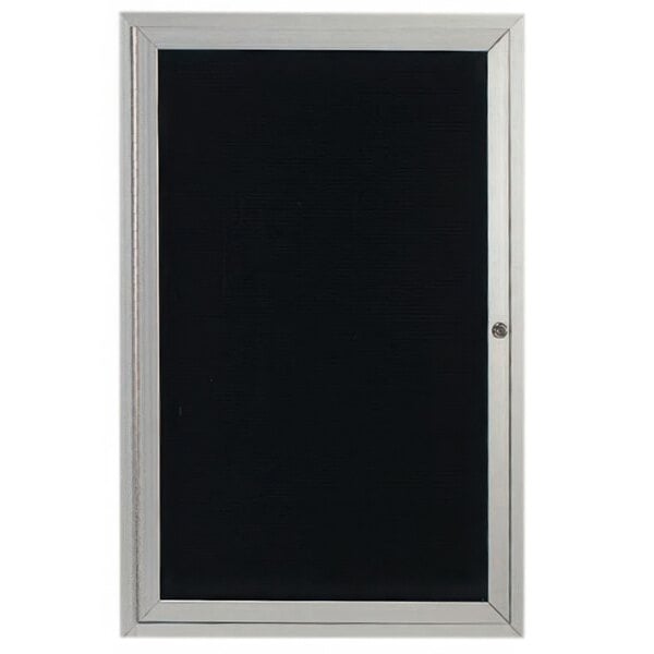 A black board with a silver frame and a white enclosed door.