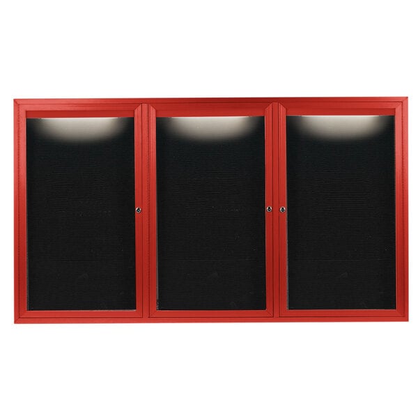 A red cabinet with black doors and a black letter board inside.