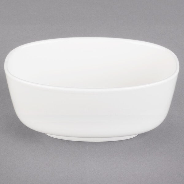 A white Villeroy & Boch oval bowl on a gray surface.