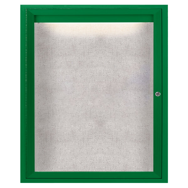 A green enclosed bulletin board cabinet with a lighted window.