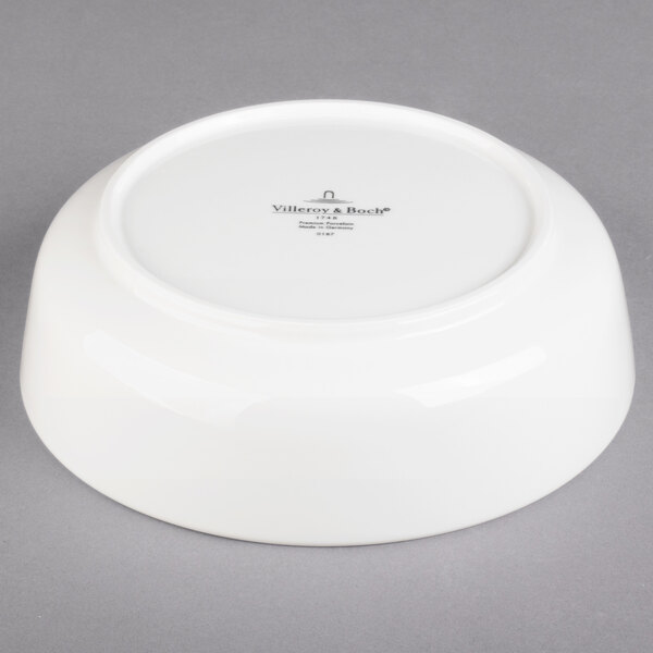 A white Villeroy & Boch porcelain serving bowl with black text on it.