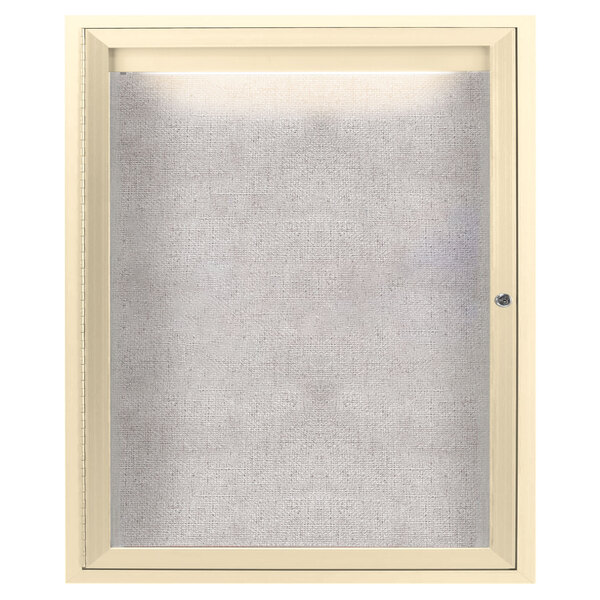 A white framed Aarco outdoor lighted bulletin board cabinet with an ivory door.
