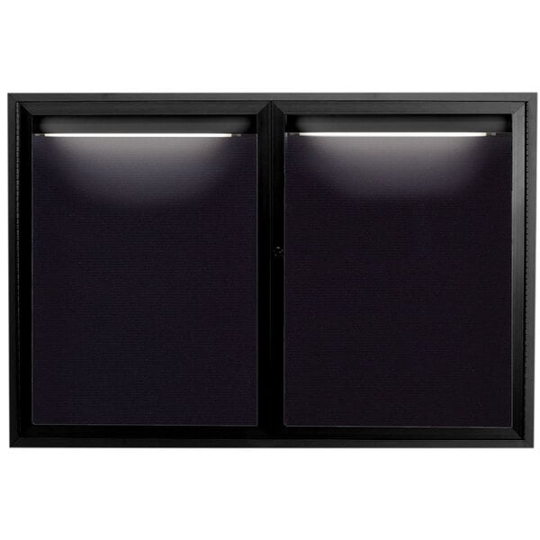 A black rectangular window with lights on the inside.