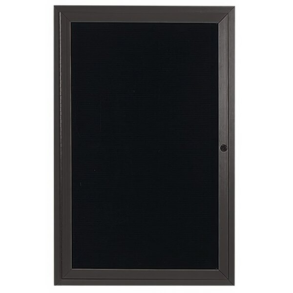 A black rectangular door with a black frame and a lock.