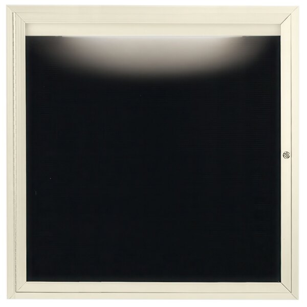 A white frame with a black screen containing black letters.
