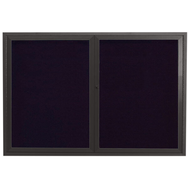 A black framed cabinet with two black doors and a black letter board inside.