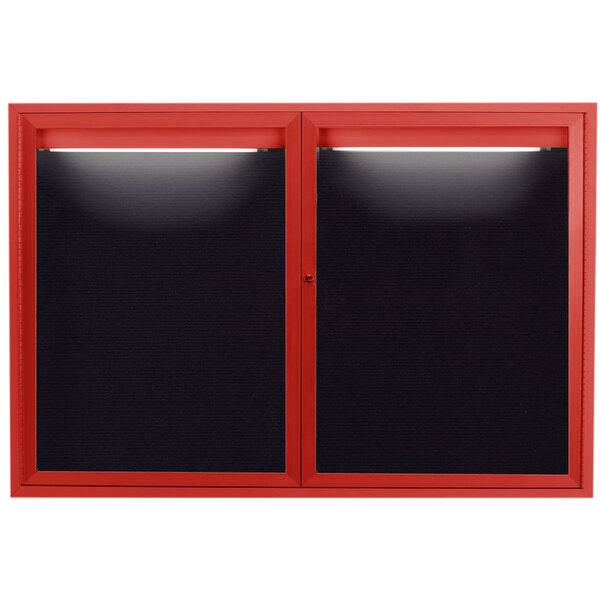 A red window with a black frame and a light on it.