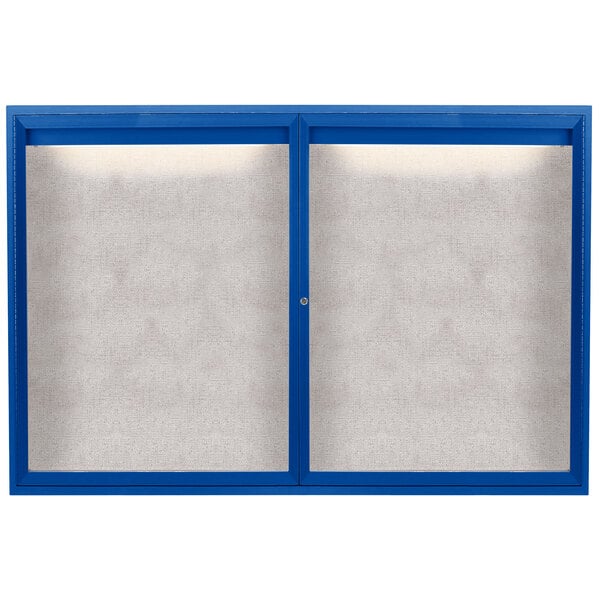 A blue powder coated Aarco outdoor bulletin board cabinet with 2 doors and a white screen.
