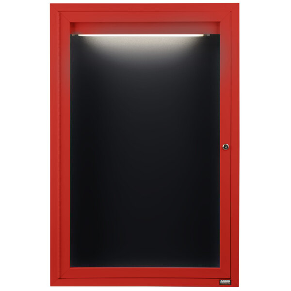 A red cabinet with a black interior and door with a black letter board inside.