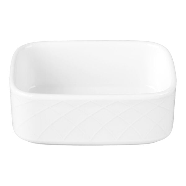 A white rectangular porcelain container with a subtle diamond pattern on the exterior.