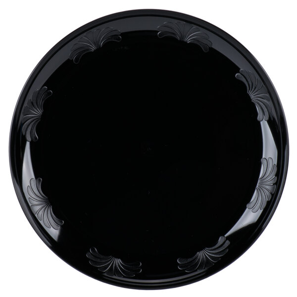 A black WNA Comet plastic plate with a black decorative design.