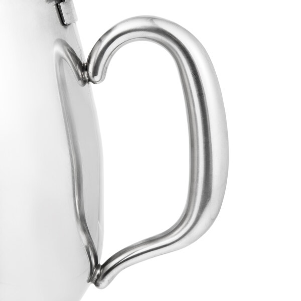 A Vollrath stainless steel coffee pot with a handle.