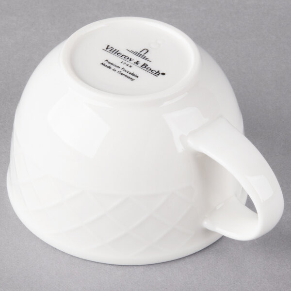 A Villeroy & Boch white porcelain cup.