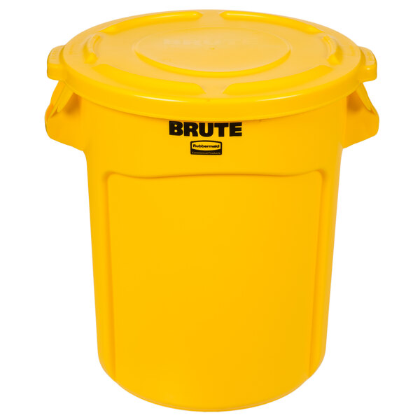 A yellow Rubbermaid BRUTE trash can and lid.