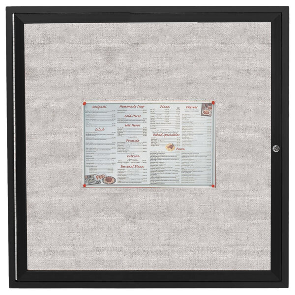 A black Aarco outdoor bulletin board cabinet with a white menu inside.