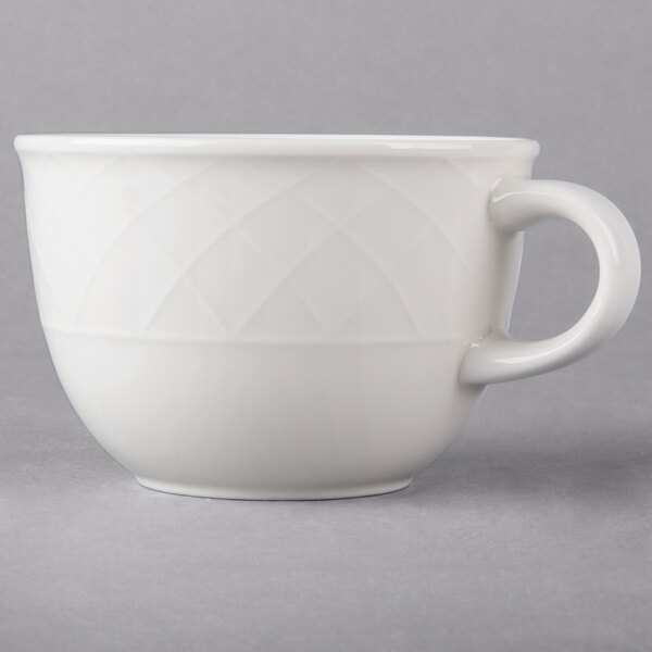 A white Villeroy & Boch porcelain cup with a handle.