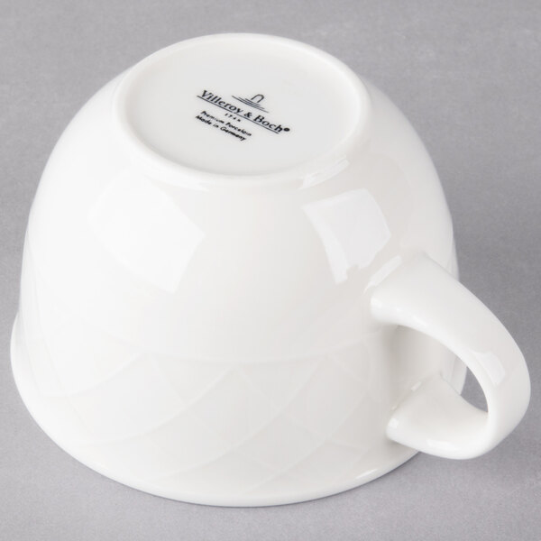 A Villeroy & Boch white porcelain cup with a handle.