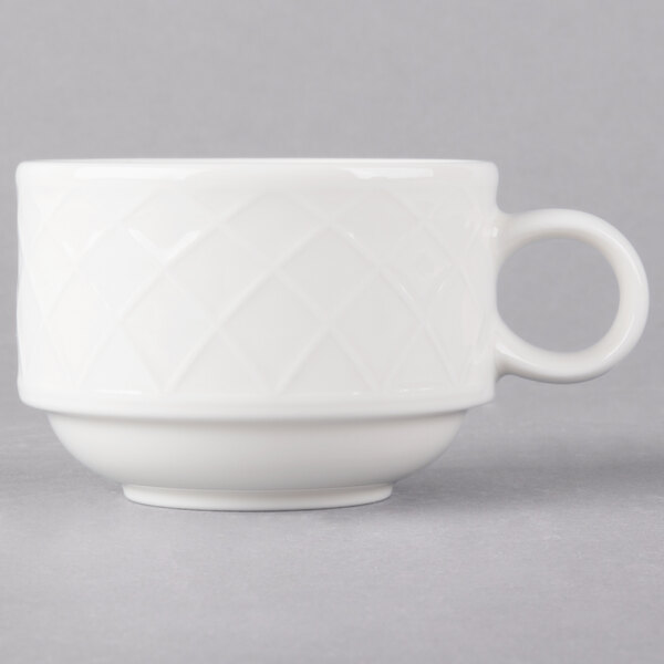 A close up of a Villeroy & Boch white porcelain stackable cup with a handle.
