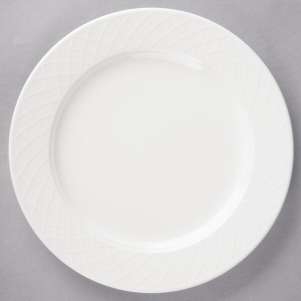 A white Villeroy & Boch porcelain plate with a circular diamond pattern.