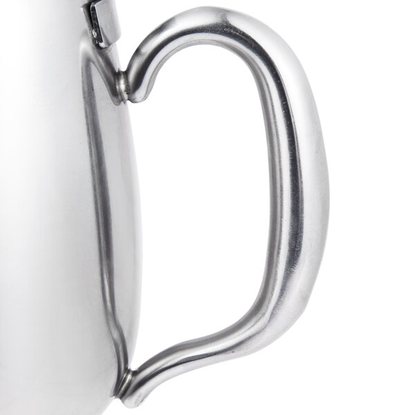 A Vollrath stainless steel creamer with a lid and handle.