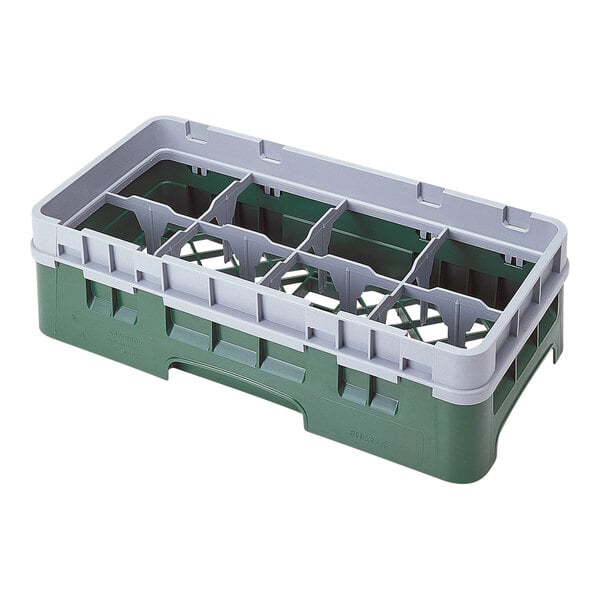 A green and grey plastic Cambro glass rack with eight compartments.