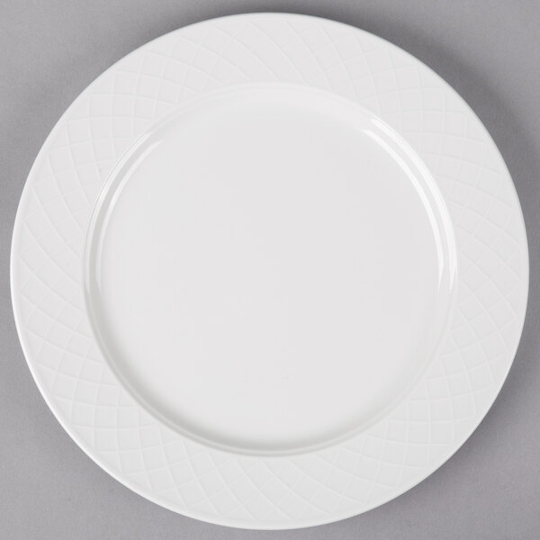 A white Villeroy & Boch porcelain plate with a circular design on it.