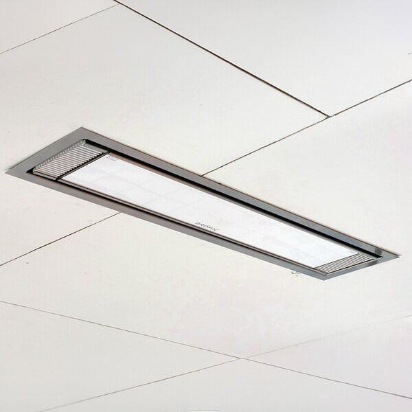 A rectangular white electric outdoor patio heater installed in a ceiling panel.