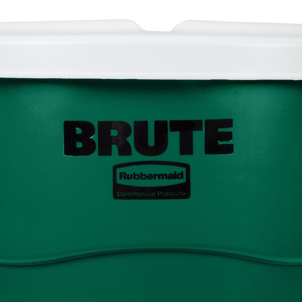 A green Rubbermaid Brute 55 gallon trash can with a white lid.