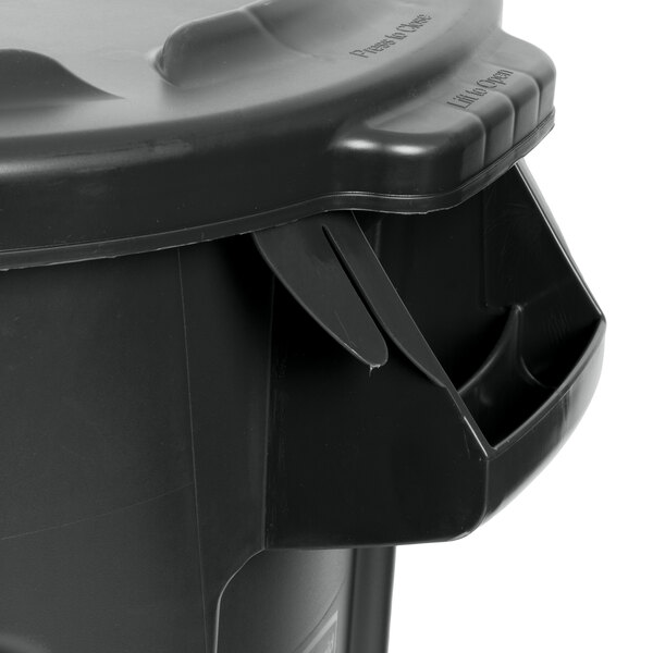 A black Rubbermaid BRUTE trash can with a lid.