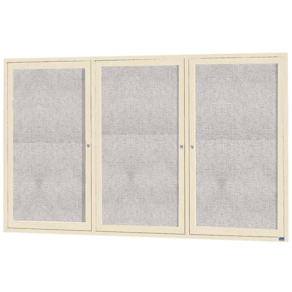 A white cabinet with 3 glass doors with black borders.