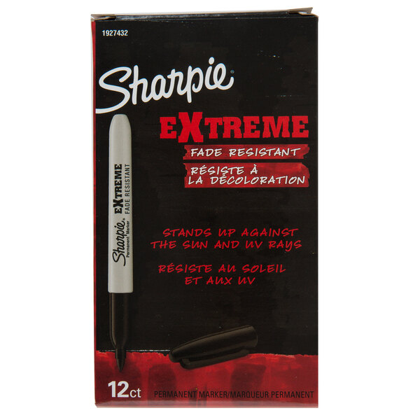 A red and black Sharpie box with a white Sharpie marker inside.